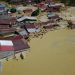 Banjir bandang  melanda 6 kecamatan di Kabupaten Luwu Utara, Provinsi Sulawesi Selatan, Senin (13/7). FOTO: BNPB